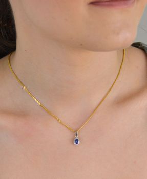 Złota zawieszka 585 białe złoto tanzanit i diamenty 60027079 HSI Złota zawieszka wykonana z próby 585 z tanzanitem i 19 diamentami o wielkości 0,06 ct, barwie H i czystości SI. Piękna i elegancka biżuteria. Zawieszka wy (4).JPG